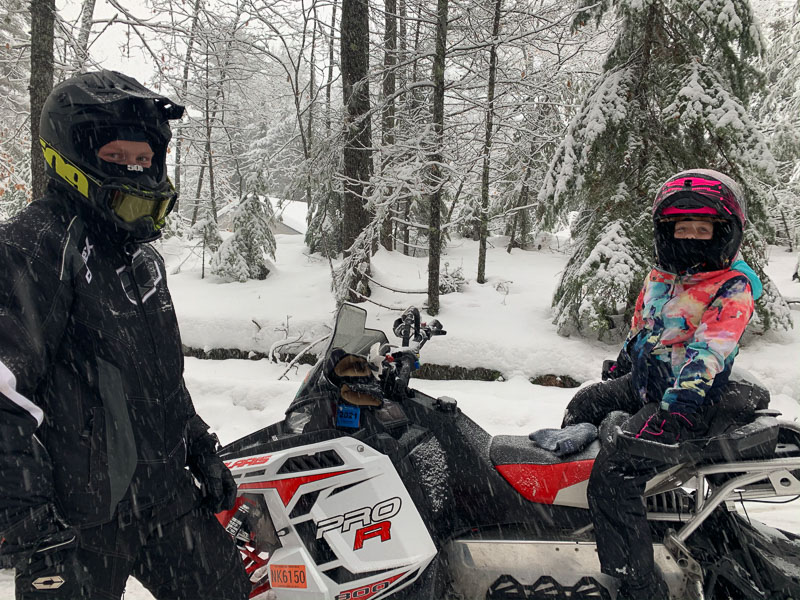 eagle river two kids on snowmobiles